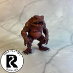 A dnd miniature red slaad painted.
