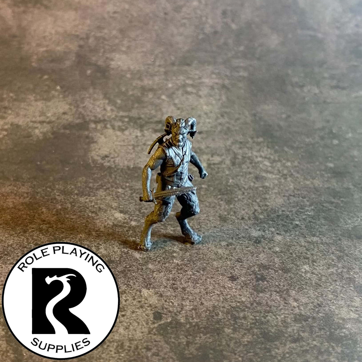 A dnd miniature satyr primed in black 28mm scale.