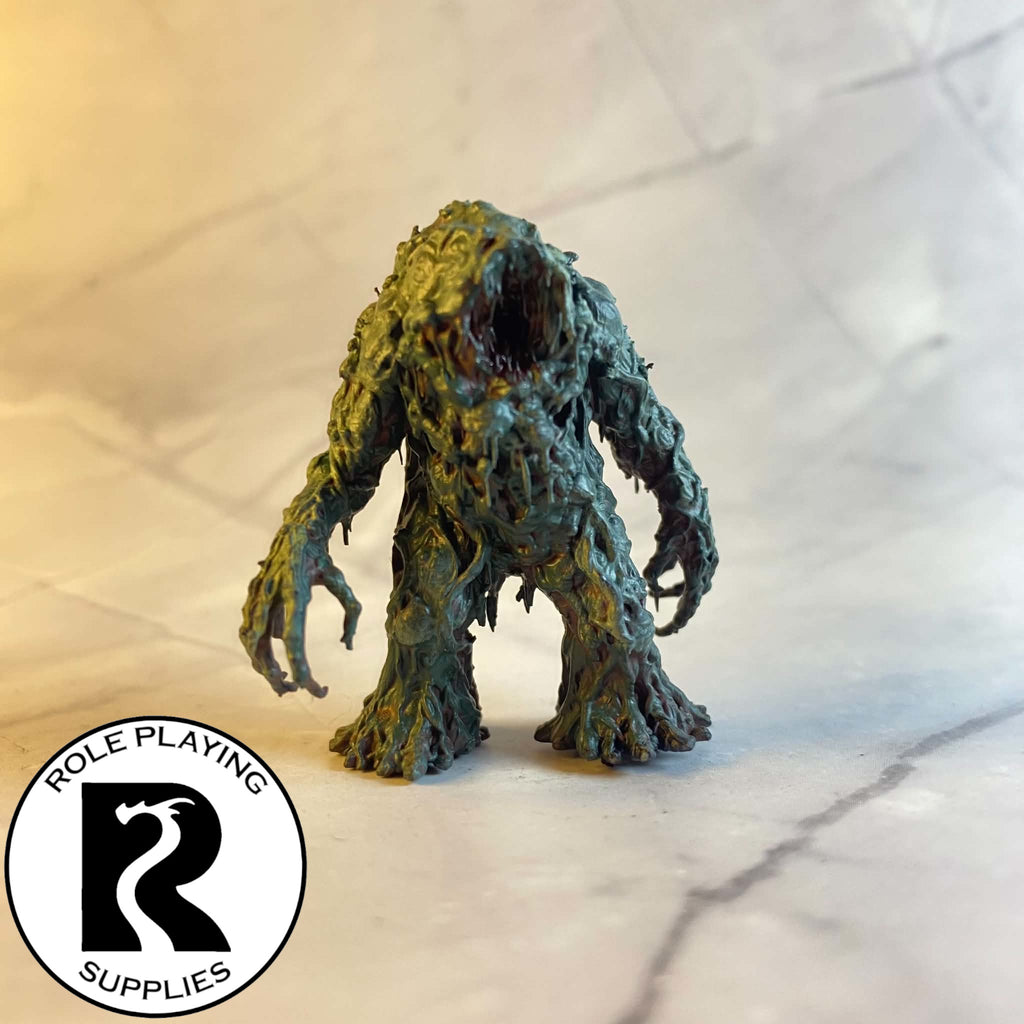 A dnd miniature shambling mound painted.
