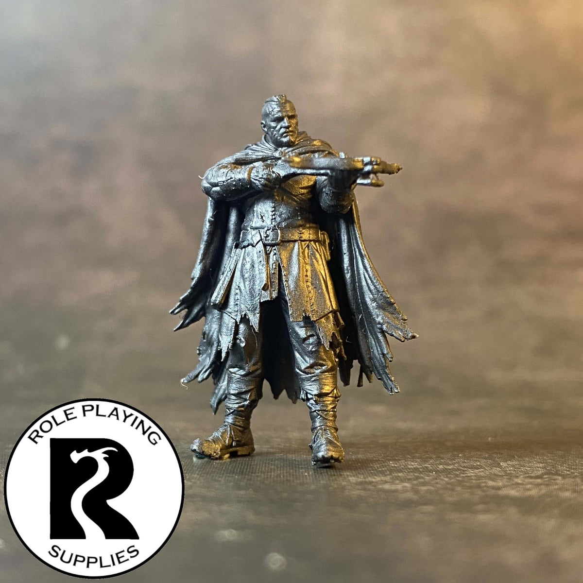 A dnd miniature thug primed in black.
