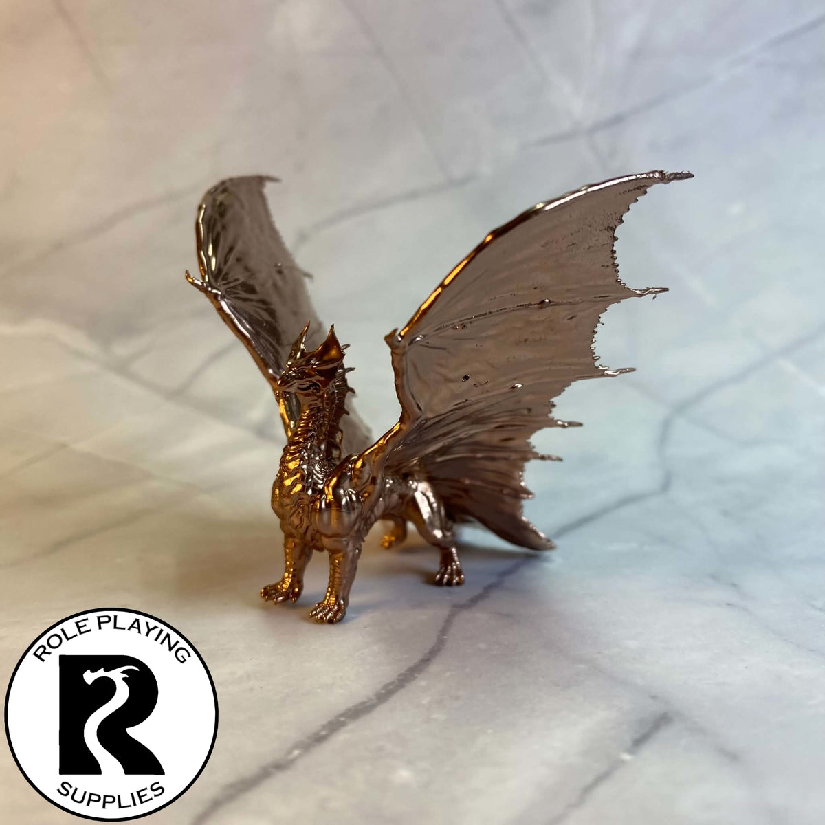 A dnd miniature young brass dragon painted.