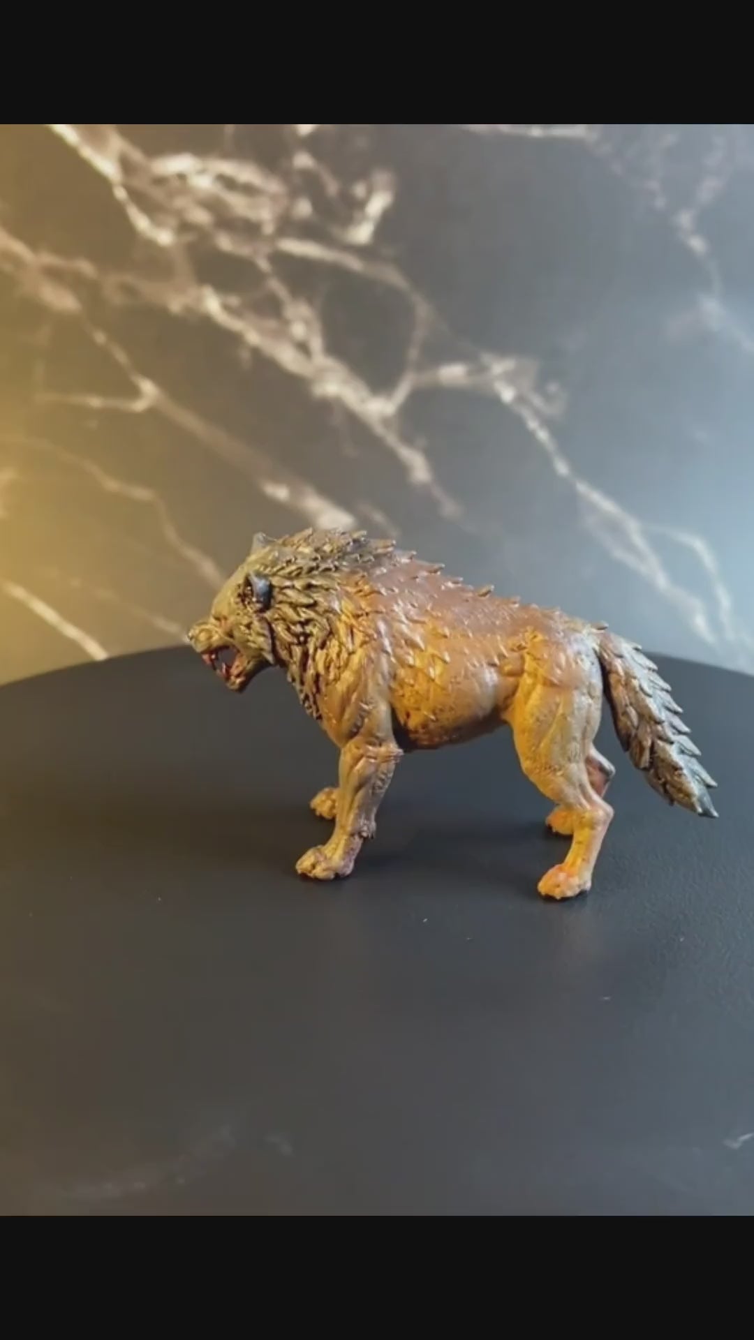 A video of a dnd miniature dire wolf painted.